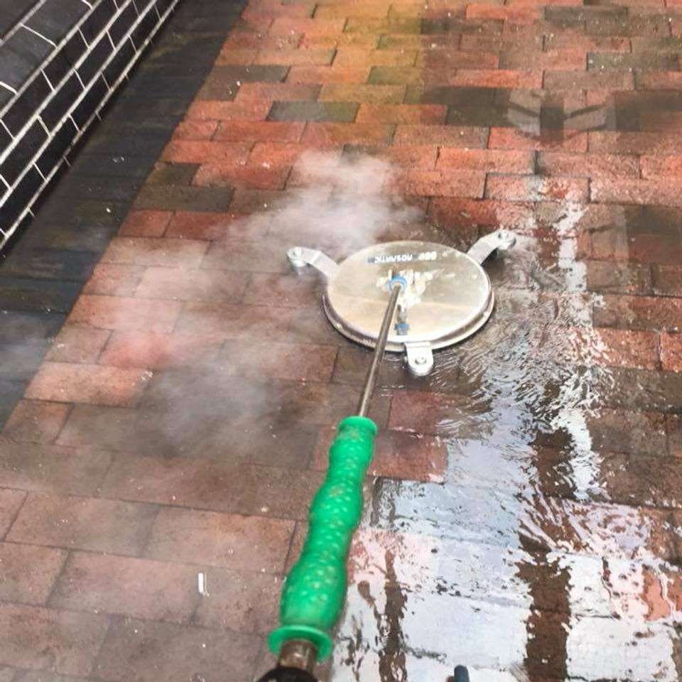 Driveway steam cleaning