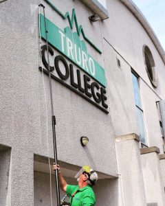 Cleaning Truro College sign